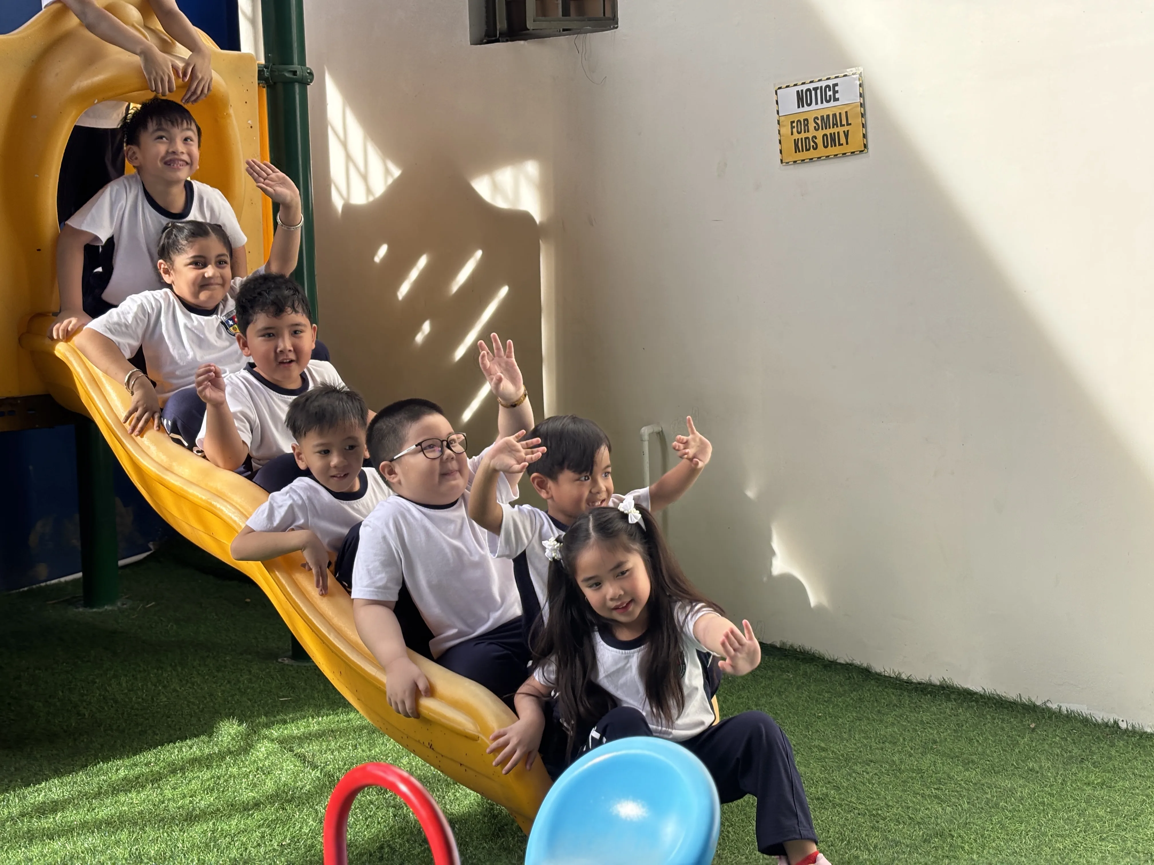 Students engaged in an outdoor learning activity at PCIS, demonstrating the school's commitment to experiential education and environmental awareness.