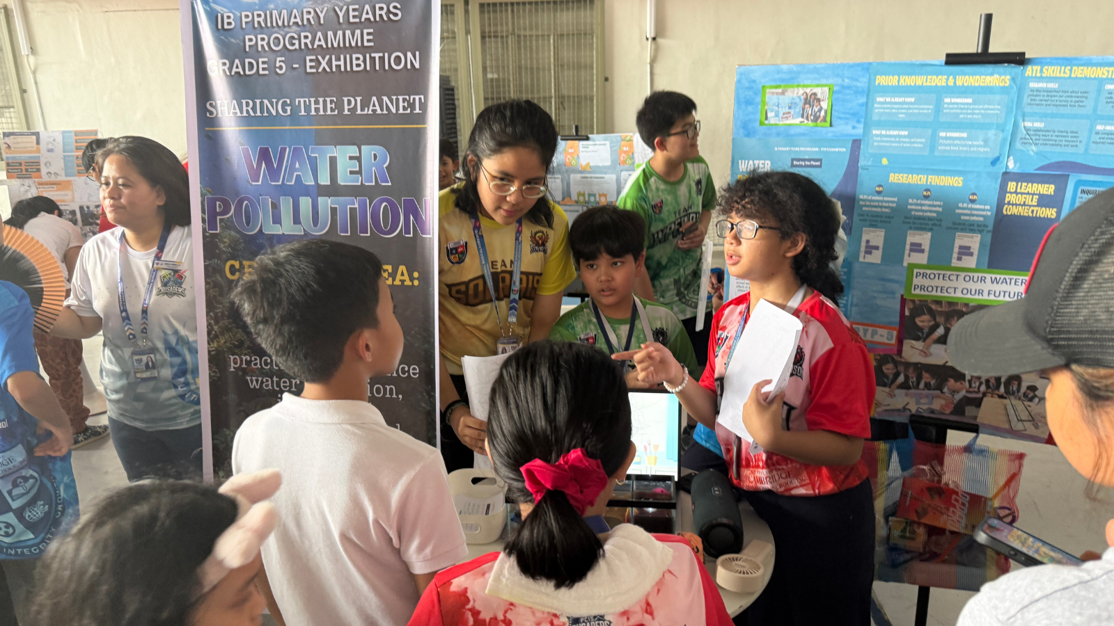 Grade 5 IB Primary Years Programme students present their Water Pollution exhibition project, demonstrating inquiry-based learning, research, and environmental awareness at Philippine Cambridge International School.