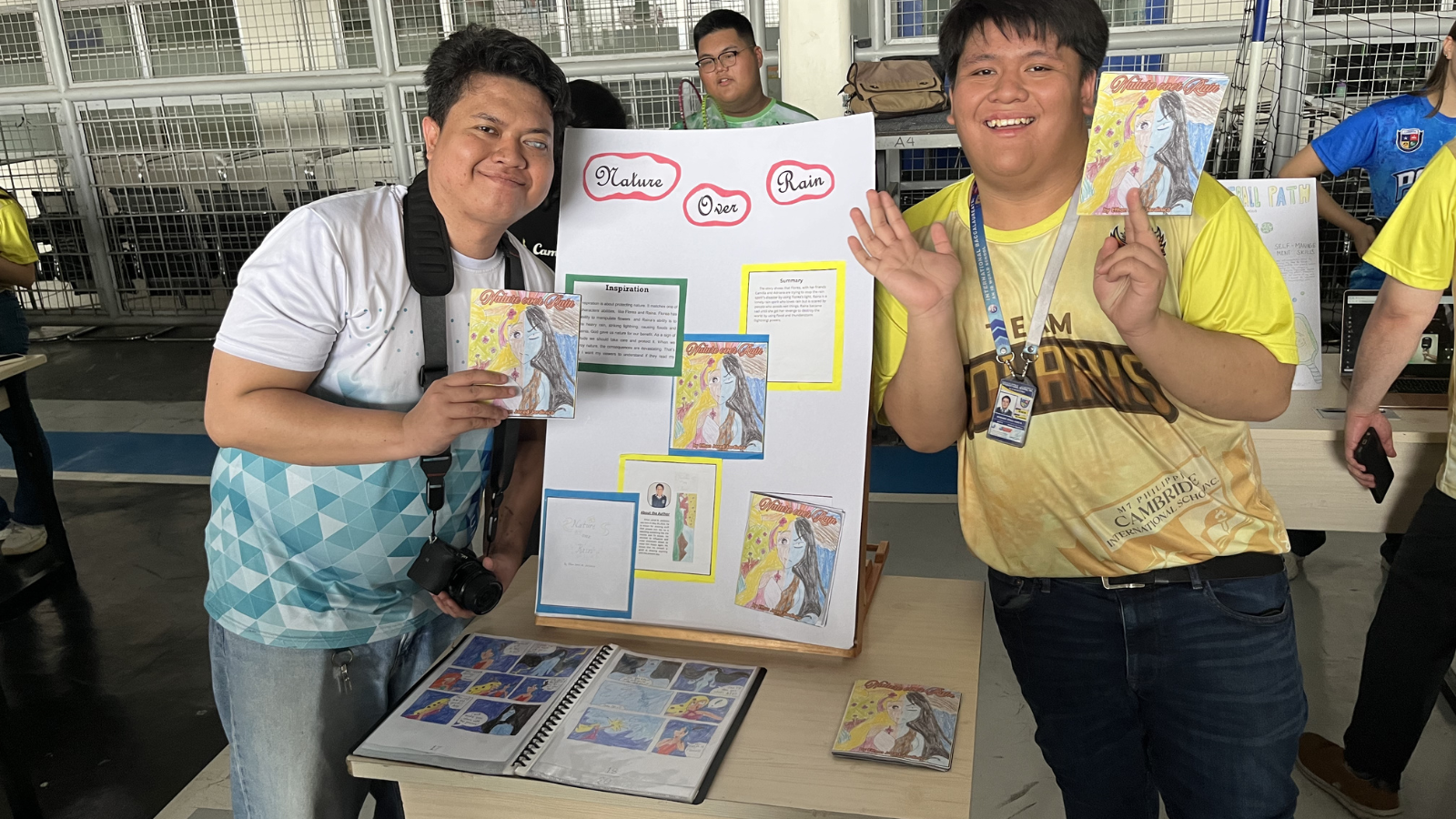 Students proudly showcase a creative literary and visual arts project during an exhibition event at Philippine Cambridge International School, highlighting student voice, creativity, and self-expression.