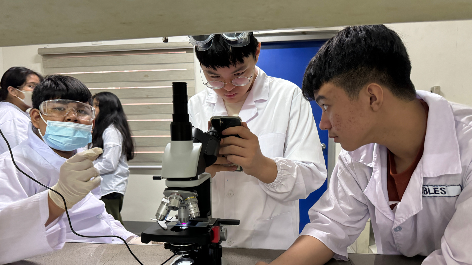 Juho Kim and PCIS learners conducting a laboratory investigation in Cavite, supporting his interest in science following his Bronze distinction in IAAC 2026