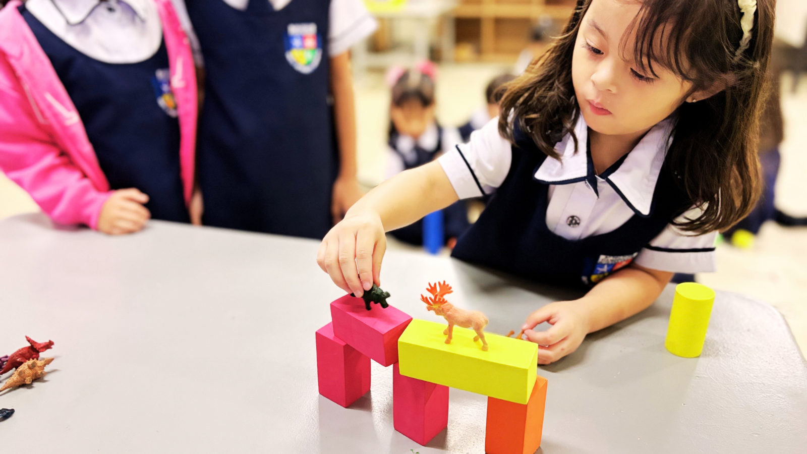 Young PCIS learners in Cavite developing ideas through hands-on exploration and creative problem-solving during an inquiry-based classroom activity.