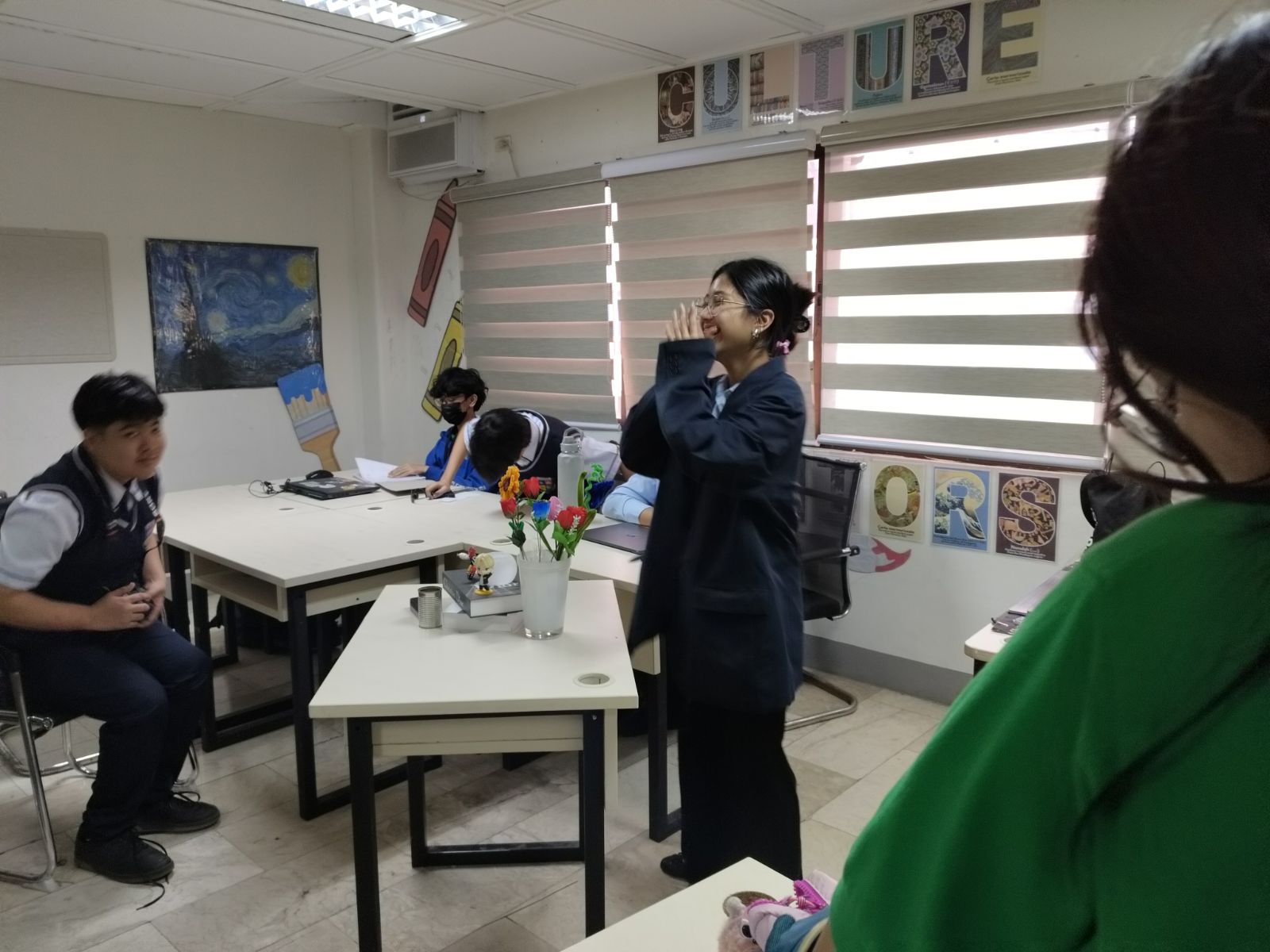 Amara Delos Santos, MYP 5 learner at Philippine Cambridge International School, participating in the Teacher-for-a-Day activity as she interacts with classmates and experiences the challenges of engaging learners and guiding classroom participation.