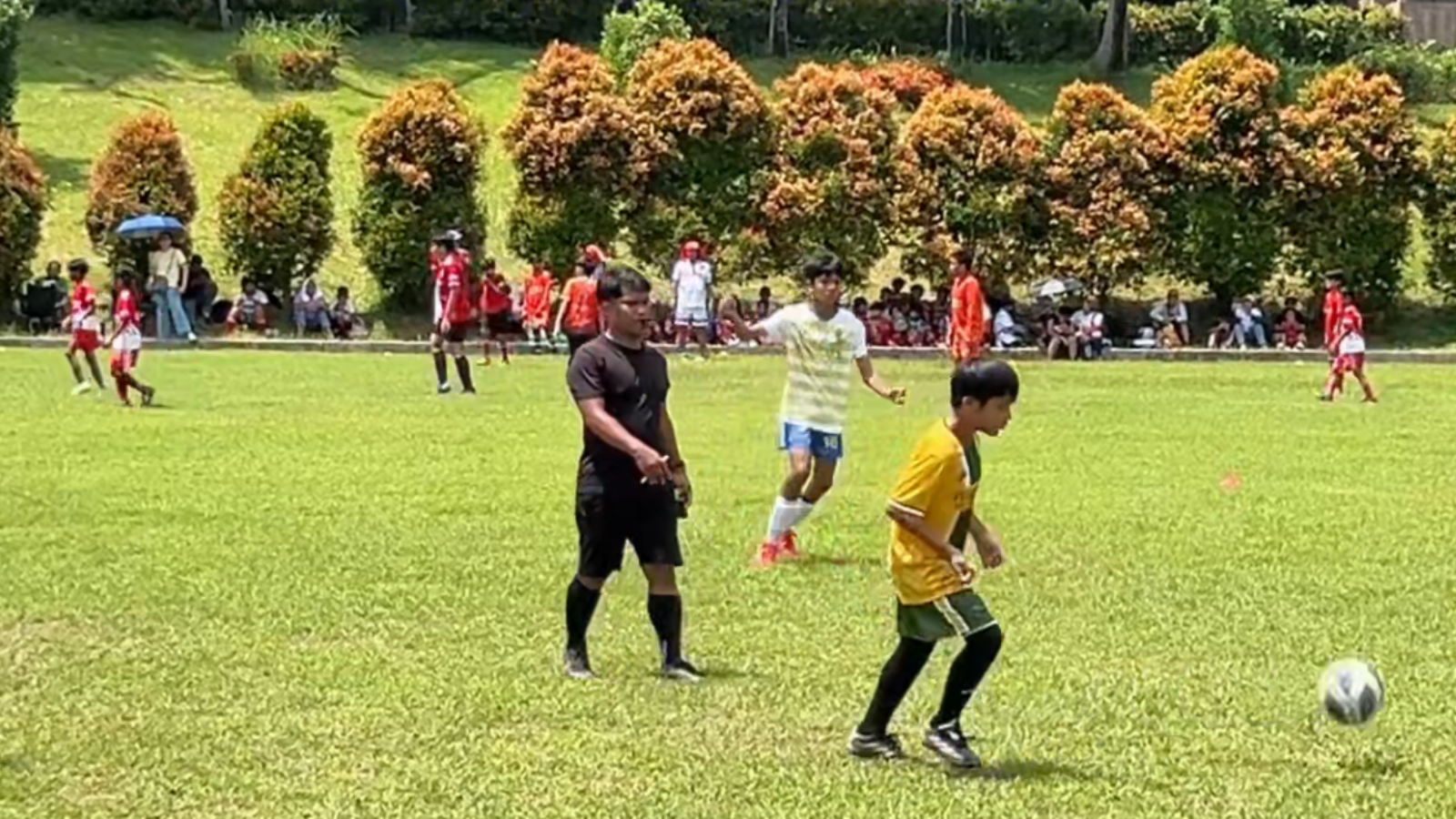 A student participating in a football match, highlighting extracurricular activities and holistic learner development at Philippine Cambridge International School, an IB World School in Cavite, Philippines.