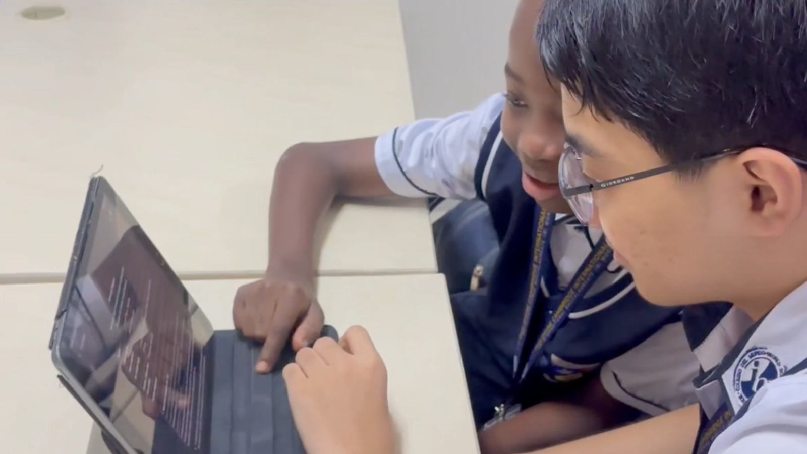 Students at Philippine Cambridge International School collaborating on a digital learning activity, demonstrating teamwork and self-management at an IB World School in Cavite, Philippines.